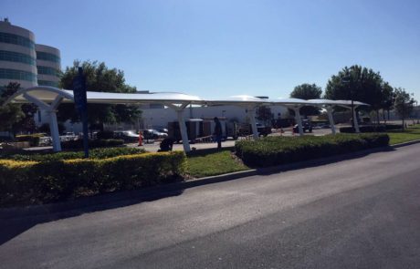 Outdoor seating area with umbrellas on a sunny day.