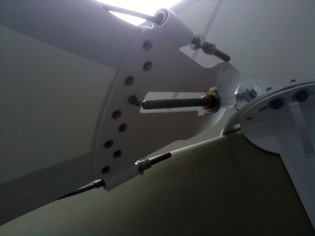 Close-up of a mechanical or robotic arm with multiple joints and hydraulic parts.