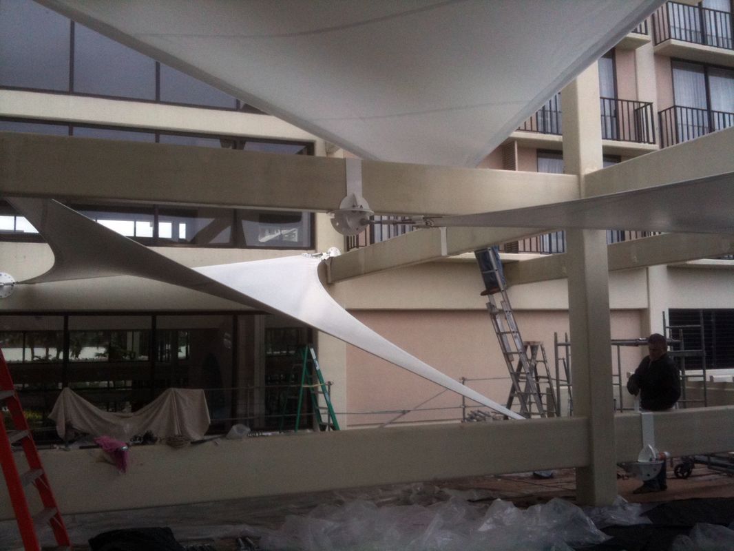 Curved architectural structure with spiral ramp under construction.