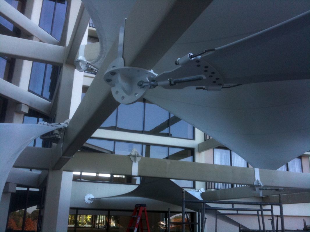Large aircraft wing inside a hangar or museum with visible support structures.