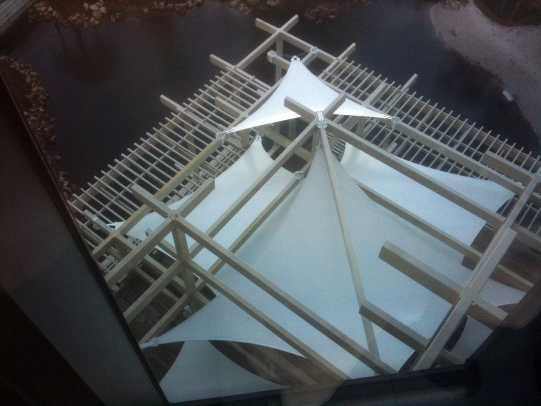 Unique architectural model with geometric shapes and structural beams.